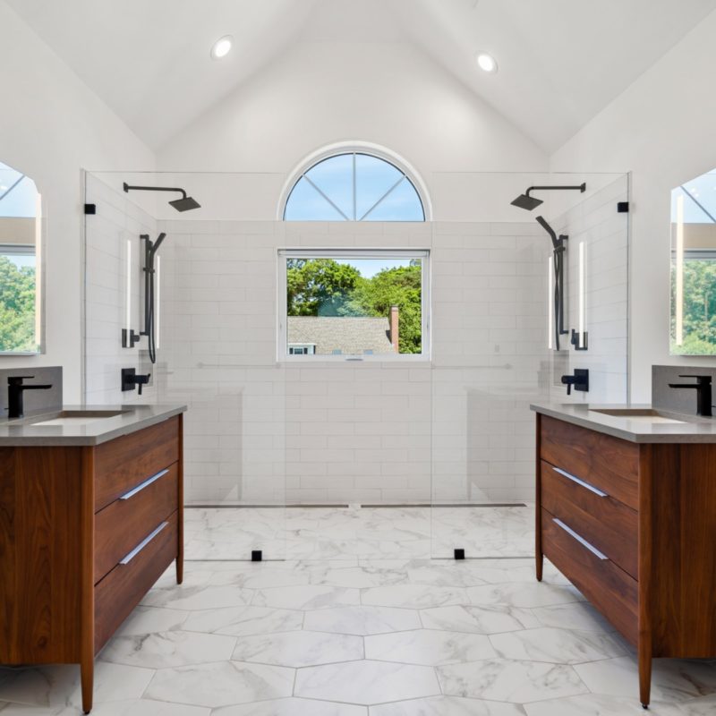 Photo of a stunning bathroom with double vanity and double shower