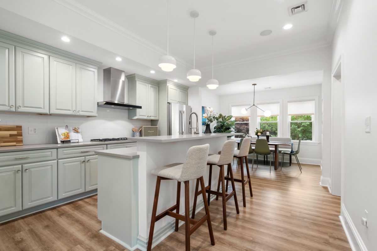 Real estate photo of kitchen with stools in Somerville, MA
